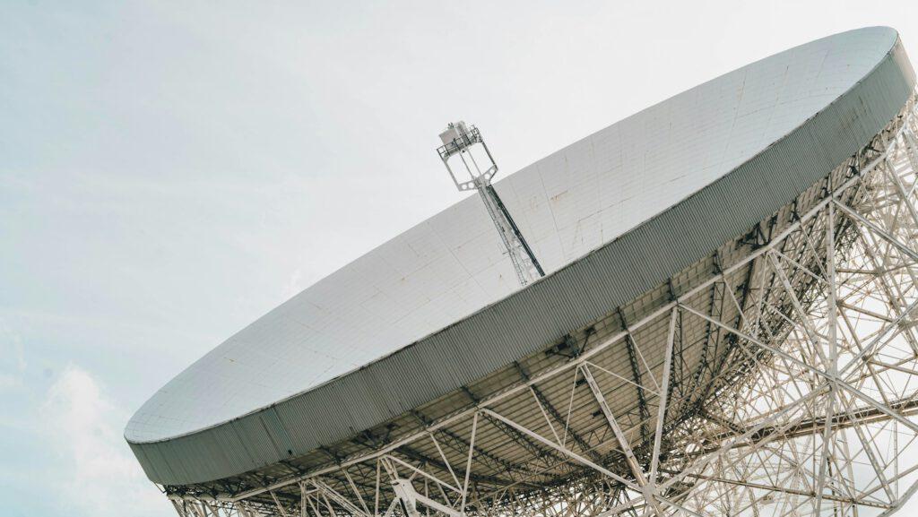 a large satellite dish sitting on top of a metal structure