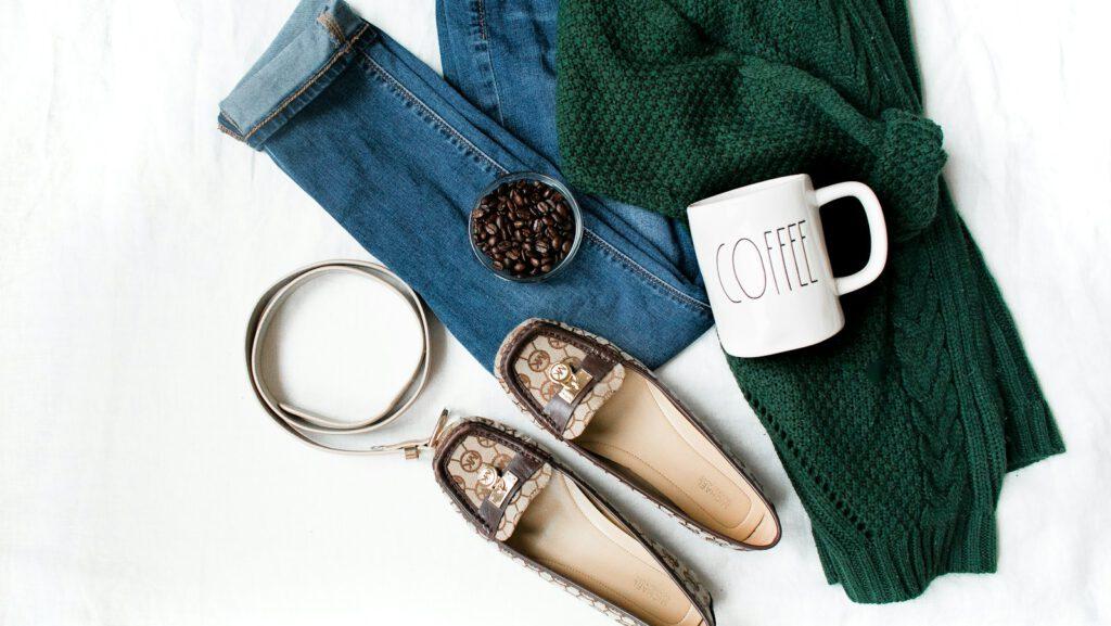 pair of brown leather flats and white ceramic mug